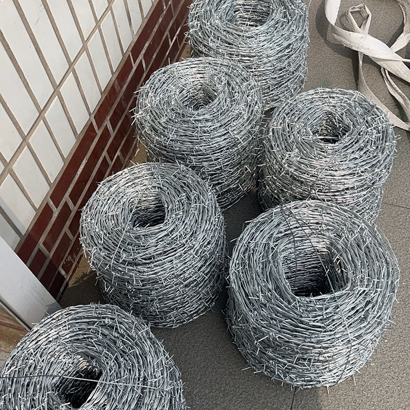 Barbed wire shipped in wooden crates.